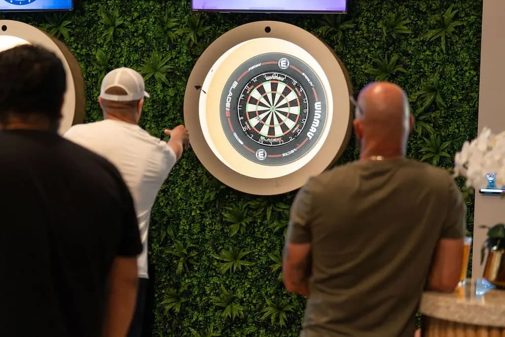 Guests playing darts at At Fault