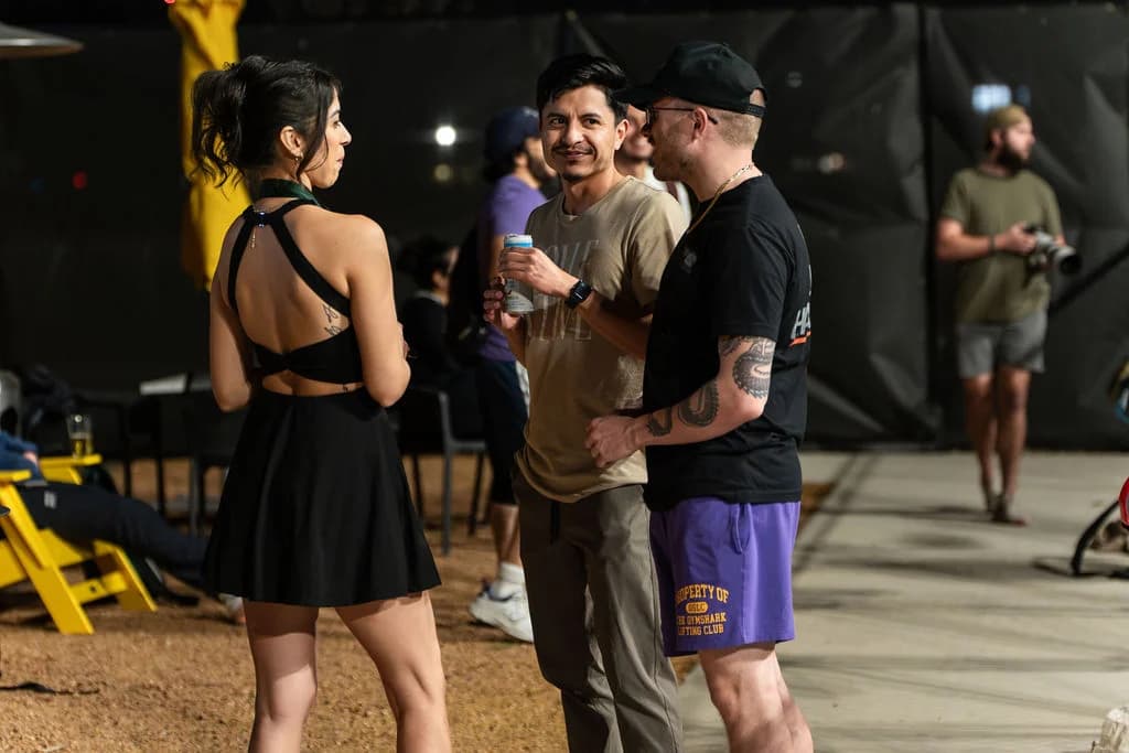 Guests mingle outside on the At Fault patio during an event