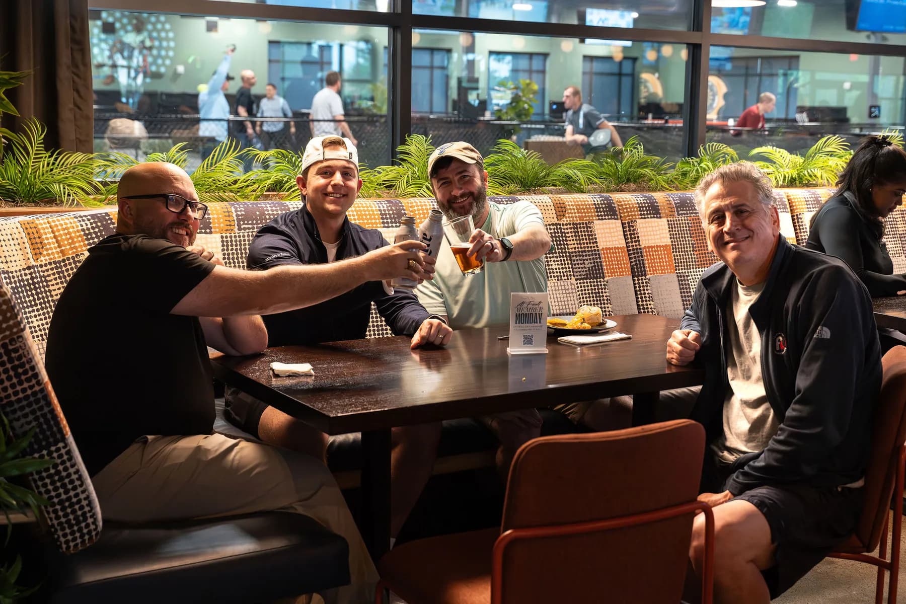Guests raising a toast at a private party at At Fault