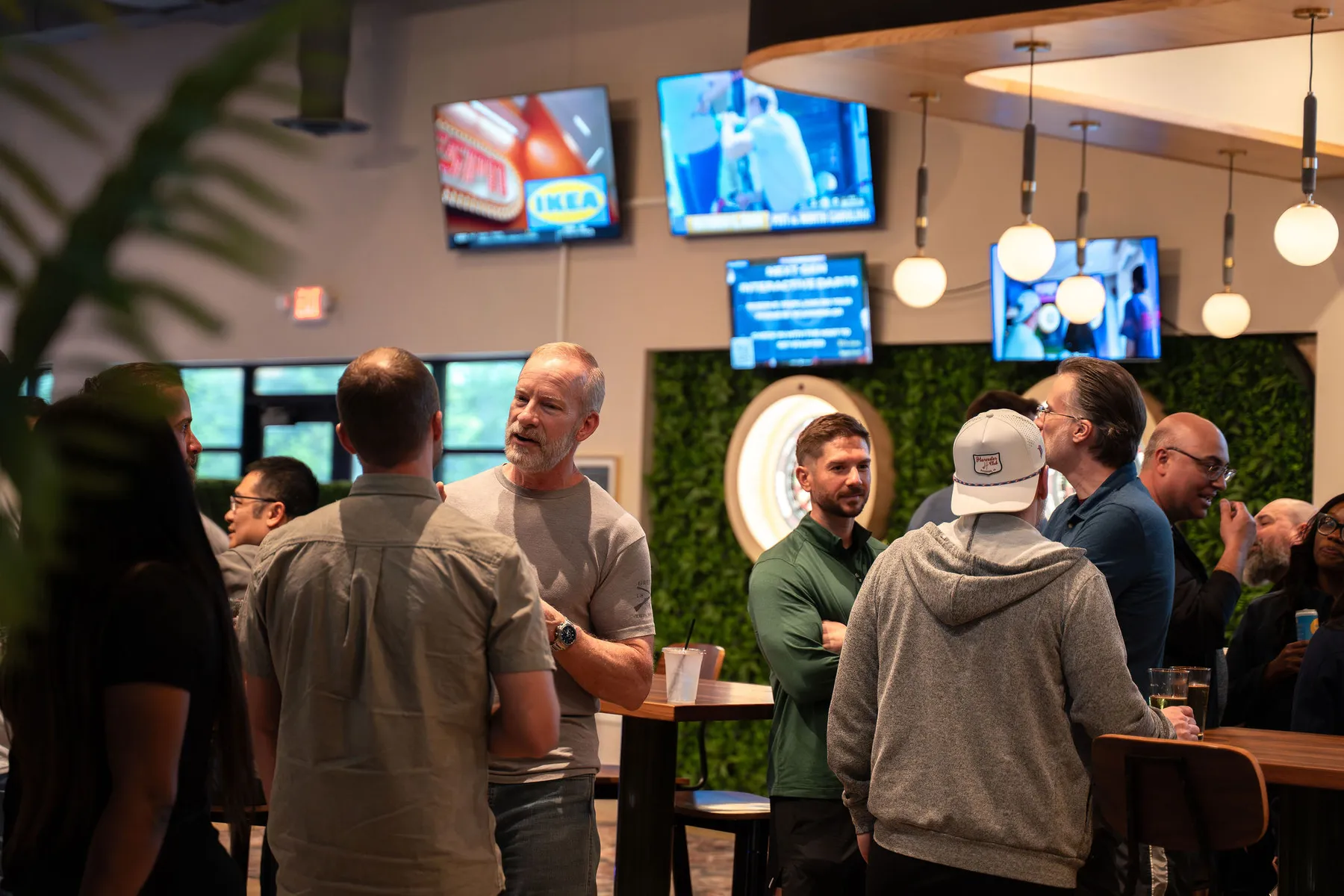 Guests mingling in the At Fault sports bar