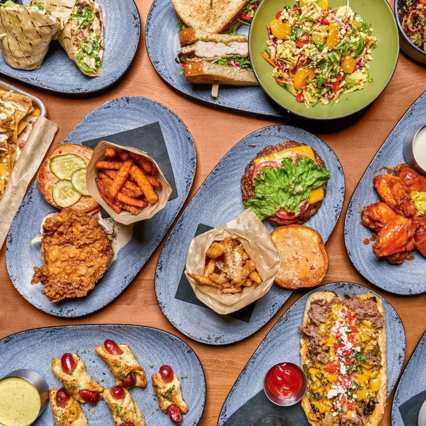 Wings, burgers, sandwiches, and other dishes from the At Fault kitchen