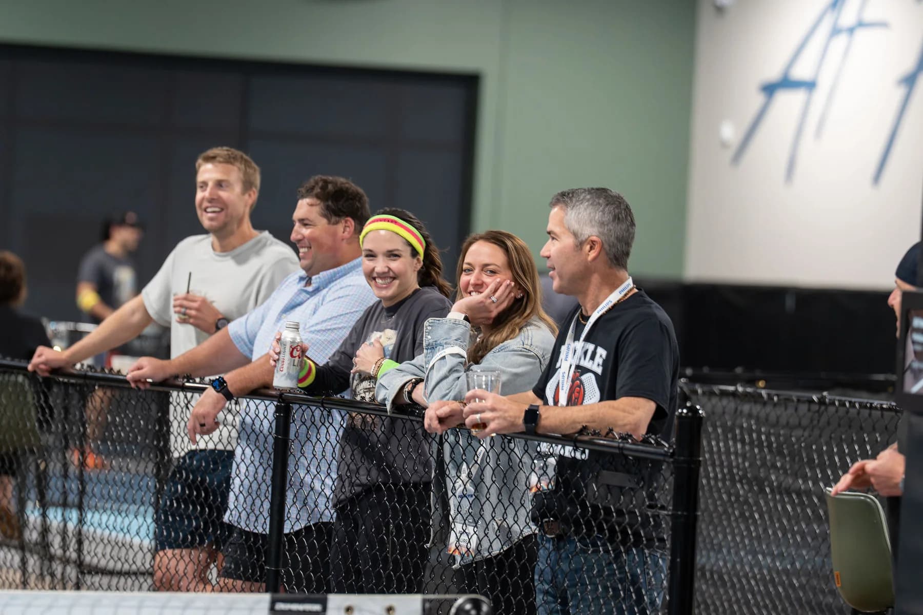 Guests watching pickleball during a group event at At Fault